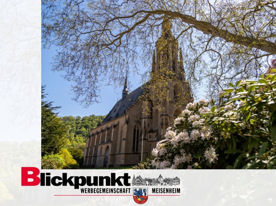Die Kirche von Meisenheim mit dem Logo der Werbegemeinschaft Blickpunkt Meisenheim